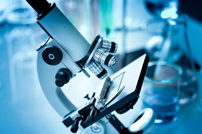closeup-shot-of-microscope-on-the-table-with-other-2022-11-09-15-04-35-utc-copy